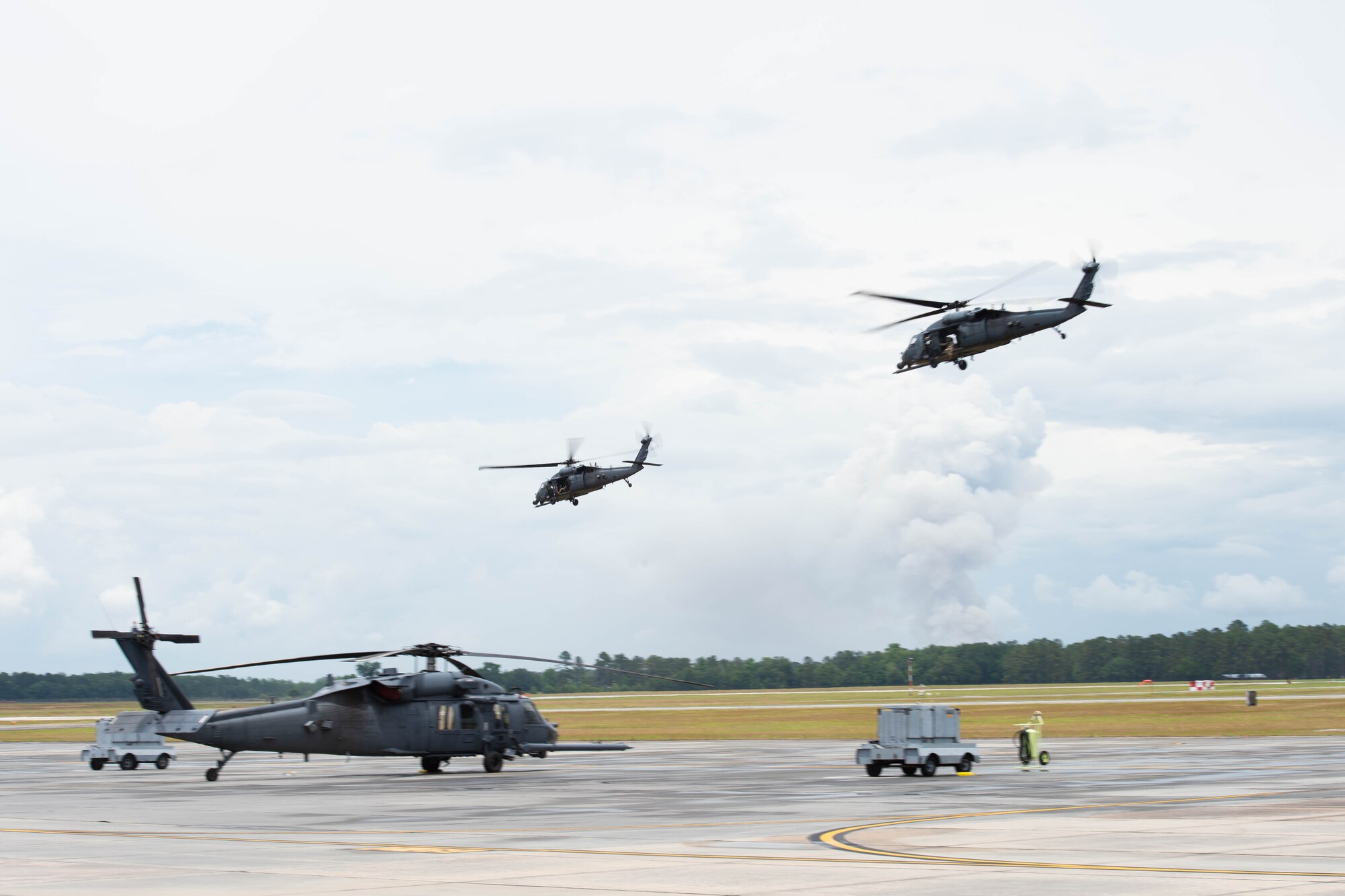 A photo of helicopters flying.