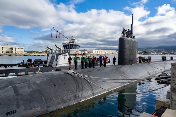 Sailors assigned to the Los Angeles-class fast-attack submarine USS Columbia (SSN 771) observe morning colors before departing Joint Base Pearl Harbor-Hickam for Exercise Agile Dagger 2021 (AD21).