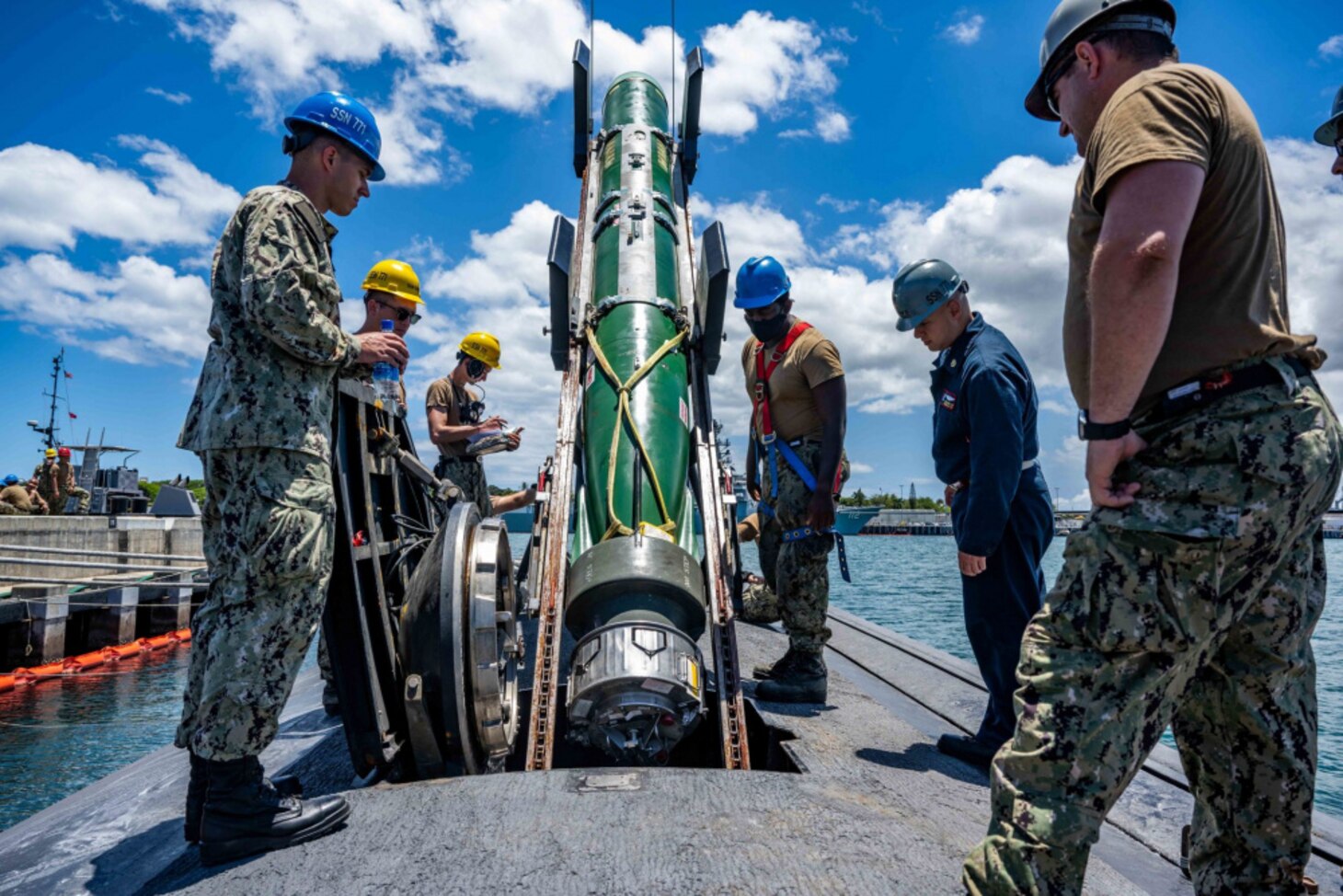 JOINT BASE PEARL HARBOR-HICKAM (June 2, 2021) -- Sailors assigned to the Los Angeles-class fast-attack submarine USS Columbia (SSN 771) load a Mark 48 advanced capability torpedo for Exercise Agile Dagger 2021 (AD21). AD21 is a training exercise, with one-third of the Pacific Submarine Force getting underway, to assess warfighting readiness and build capacity for the joint force. (U.S. Navy photo by Mass Communication Specialist 1st Class Michael B. Zingaro/Released)