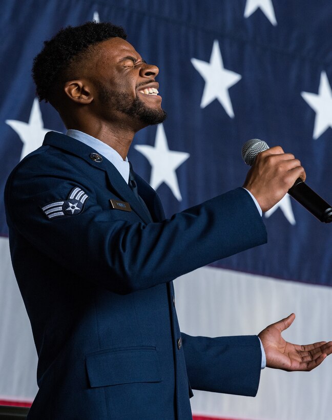 Senior Airman Joshua Varner, 436th Aerial Port Squadron fleet service specialist, sings the national anthem during the 436th Airlift Wing Assumption of Command ceremony on Dover Air Force Base, Delaware, June 4, 2021. Col. Matthew Husemann assumed command of the Eagle Wing in a ceremony officiated by 18th Air Force commander Maj. Gen. Thad Bibb. (U.S. Air Force photo by Roland Balik)