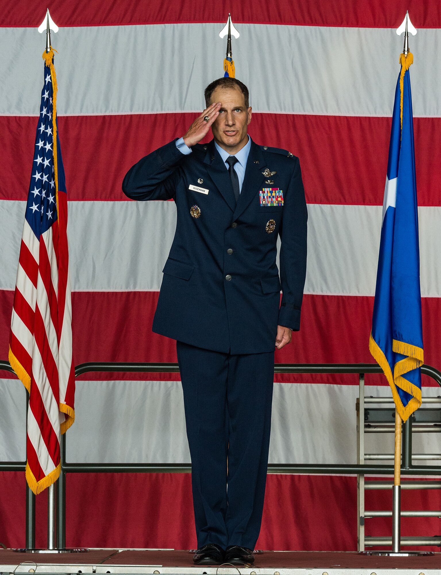 Col. Matthew Husemann, 436th Airlift Wing commander, receives his first salute from a formation of Team Dover Airmen during the 436th AW Assumption of Command ceremony on Dover Air Force Base, Delaware, June 4, 2021. Husemann takes command following an assignment as the 86th Airlift Wing vice commander at Ramstein Air Base, Germany. (U.S. Air Force photo by Roland Balik)
