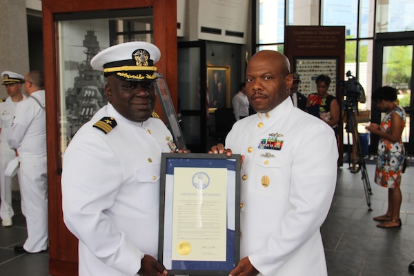 RICHMOND, Va. (Jun2 2, 2021) Cmdr. Corey Odom, the commanding officer of the Arleigh Burke-class guided missile destroyer USS Gravely (DDG 107), and Command Master Chief Dion Dupree, Gravely�s command master chief, pose with V. Gov. Ralph Northam�s proclamation designating June 2 as "Admiral Samuel L. Gravely Day". (U.S. Navy courtesy photo/Released)