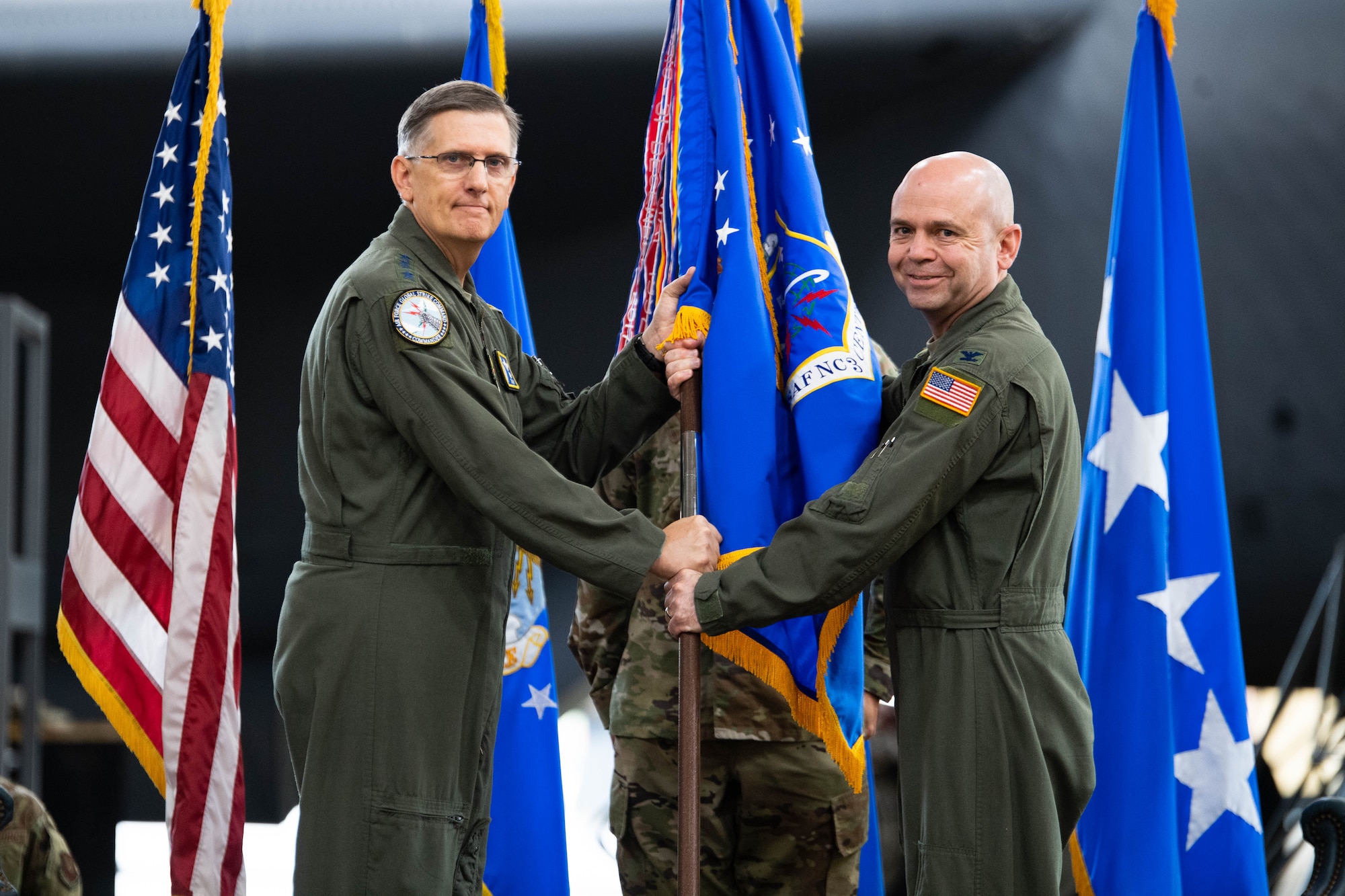 Col. Craig M. Ramsey, right, outgoing U.S. Air Force Nuclear Command, Control and Communications commander, relinquishes the guidon to Gen. Timothy M. Ray, Air Force Global Strike Command commander, during the AFNC3 deactivation ceremony at Barksdale Air Force Base, Louisiana, June 4, 2021. Originally stood up by AFGSC in 2017, the AFNC3 Center was formally deactivated June 4. (U.S. Air Force photo by Senior Airman Jacob B. Wrightsman)