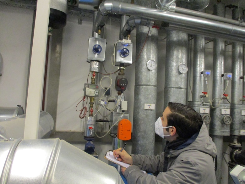 Salvatore Corcione, resource efficiency manager at U.S. Army Garrison-Ansbach, performs a utility check at one of the facilities on the inst