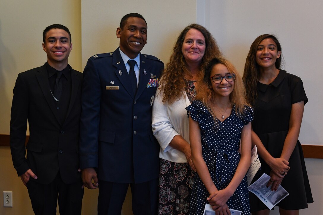 Col. Marcus Jackson, Buckley Garrison commander, and his family pose for a photo after the Buckley Garrison’s Assumption of Command Ceremony at Buckley Space Force Base, Colo., June 4, 2021. Jackson expressed his gratitude for those who paved the way, his mentors, and his family for their support. He also highlighted the significance of the base renaming ceremony and the honor of serving in this new position. (U.S. Space Force photo by Senior Airman Danielle McBride)