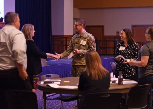 U.S. Air Force Capt. Joshua Garvison, 313th Training Squadron flight commander, engages with a fellow Air Force Community Partnership member at the quarterly meeting at Angelo State University’s Houston Harte University Center in San Angelo, Texas, June 3, 2021. The Goodfellow AFCP Program united the base and community for mutual benefit. (U.S. Air Force photo by Senior Airman Abbey Rieves)