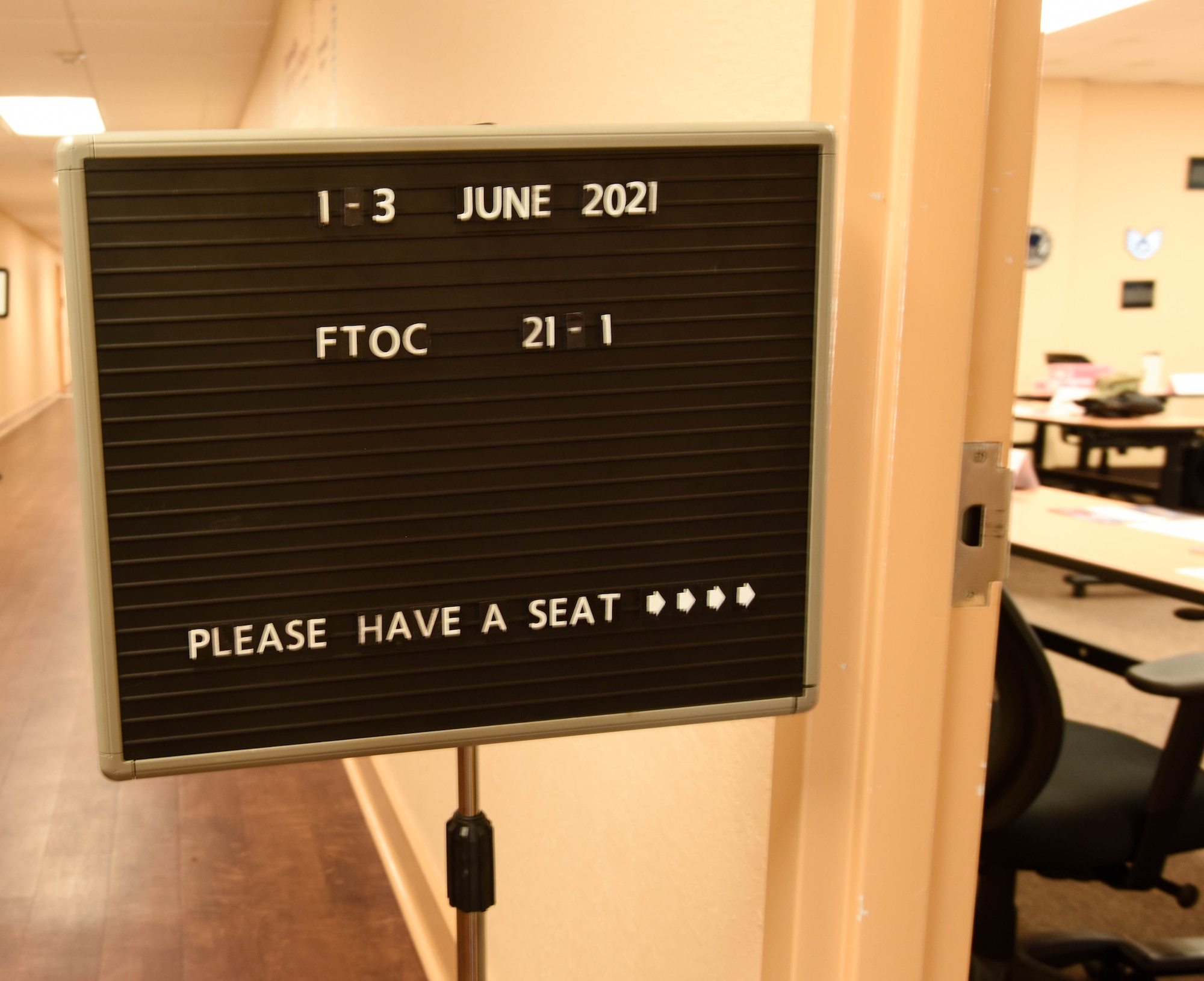 A First Term Officers Course sign is displayed in the Professional Development Center at Keesler Air Force Base, Mississippi June 1, 2021. The FTOC is the first course of its kind implemented at Keesler to further develop new company grade officers into leaders. (U.S Air Force photo by Airman 1st Class Jasmine Galloway)
