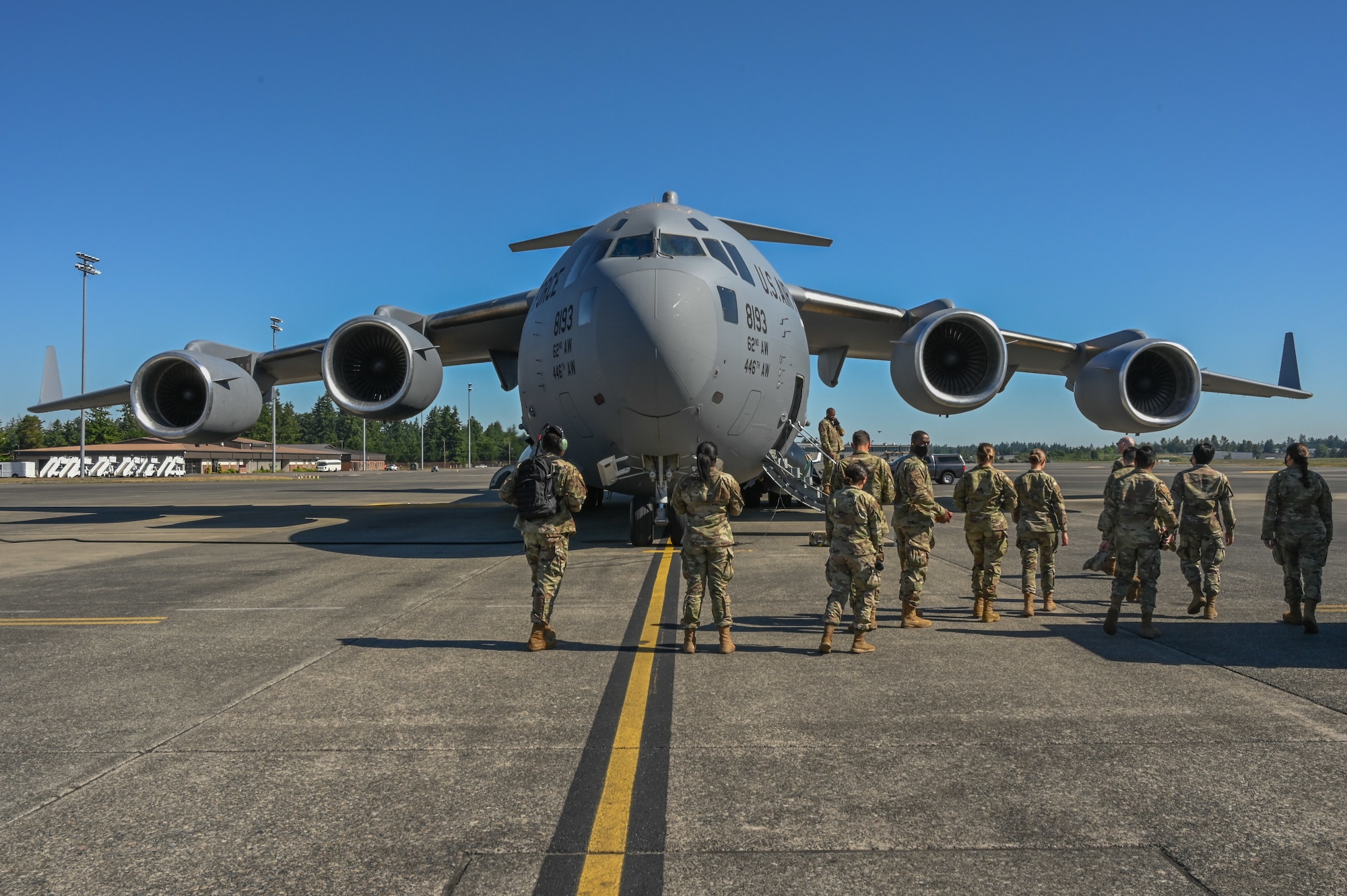 Team McChord Airmen board a C-17 Globemaster III as part of Airmen Experience at Joint Base Lewis-McChord, Washington, June 2, 2021. As part of the Airmen Experience, Airmen receive a briefing about the Team McChord mission, tour different units as well as participate in an orientation flight. (U.S. Air Force photo by Airman 1st Class Callie Norton)