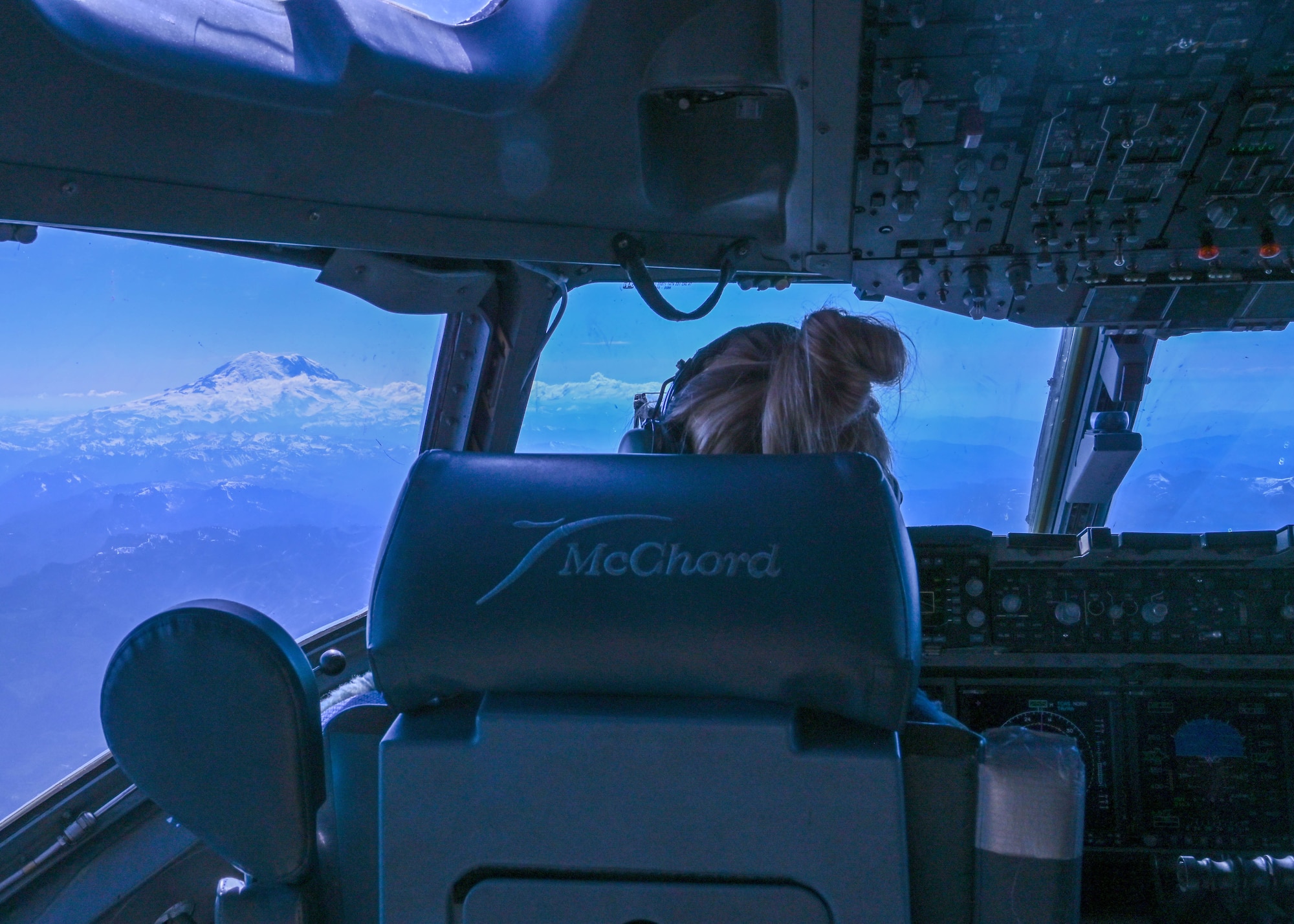 U.S. Air Force Capt. Katelyn Maffei, 4th Airlift Squadron pilot, flies a C-17 Globemaster III over Mount Rainier, Washington, June 2, 2021. The 4th AS hosted the Airmen Experience for an orientation flight where they conducted an air refueling exercise. (U.S. Air Force photo by Airman 1st Class Callie Norton)