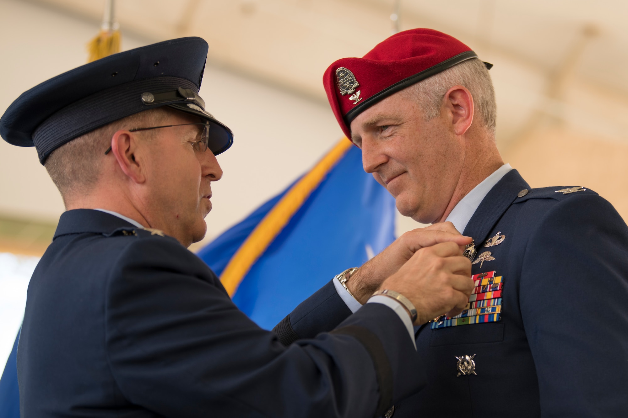 .S. Air Force Col. Matthew Allen, outgoing commander of the 24th Special Operations Wing, receives the Legion of Merit from U.S. Air Force Lt. Gen. Jim Slife, commander of Air Force Special Operations Command, during a change of command ceremony at Hurlburt Field, Florida, June 4, 2021.