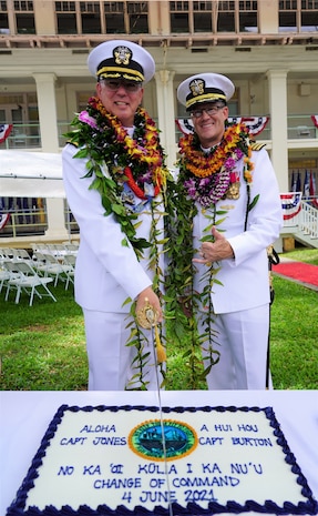 Pearl Harbor, Hawaii (June 4, 2021) Captain Richard Jones, commander, Pearl Harbor Naval Shipyard and Intermediate Maintenance Facility, and Captain Greg Burton cut the cake in celebration of Pearl Harbor Naval Shipyard and Intermediate Maintenance Facility (PHNSY & IMF) change of command ceremony. PHNSY & IMF is a field activity of NAVSEA and a one-stop regional maintenance center for the Navy’s surface ships and submarines. (U.S. Navy photo by Justice Vannatta/Released)