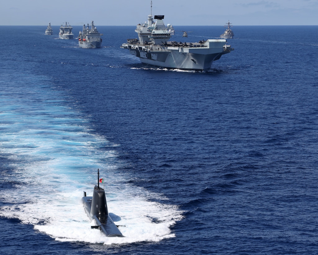 HMS Queen Elizabeth and USS The Sullivans with the United Kingdom Carrier Strike Group joined ships with NATO Standing Maritime Groups One and Two for an impressive display of maritime power in the Eastern Atlantic on 28 May 2021. The rendezvous was part of Steadfast Defender 21, a large scale defensive exercise designed to test NATO’s ability to rapidly deploy forces from North America to the coast of Portugal and the Black Sea region.