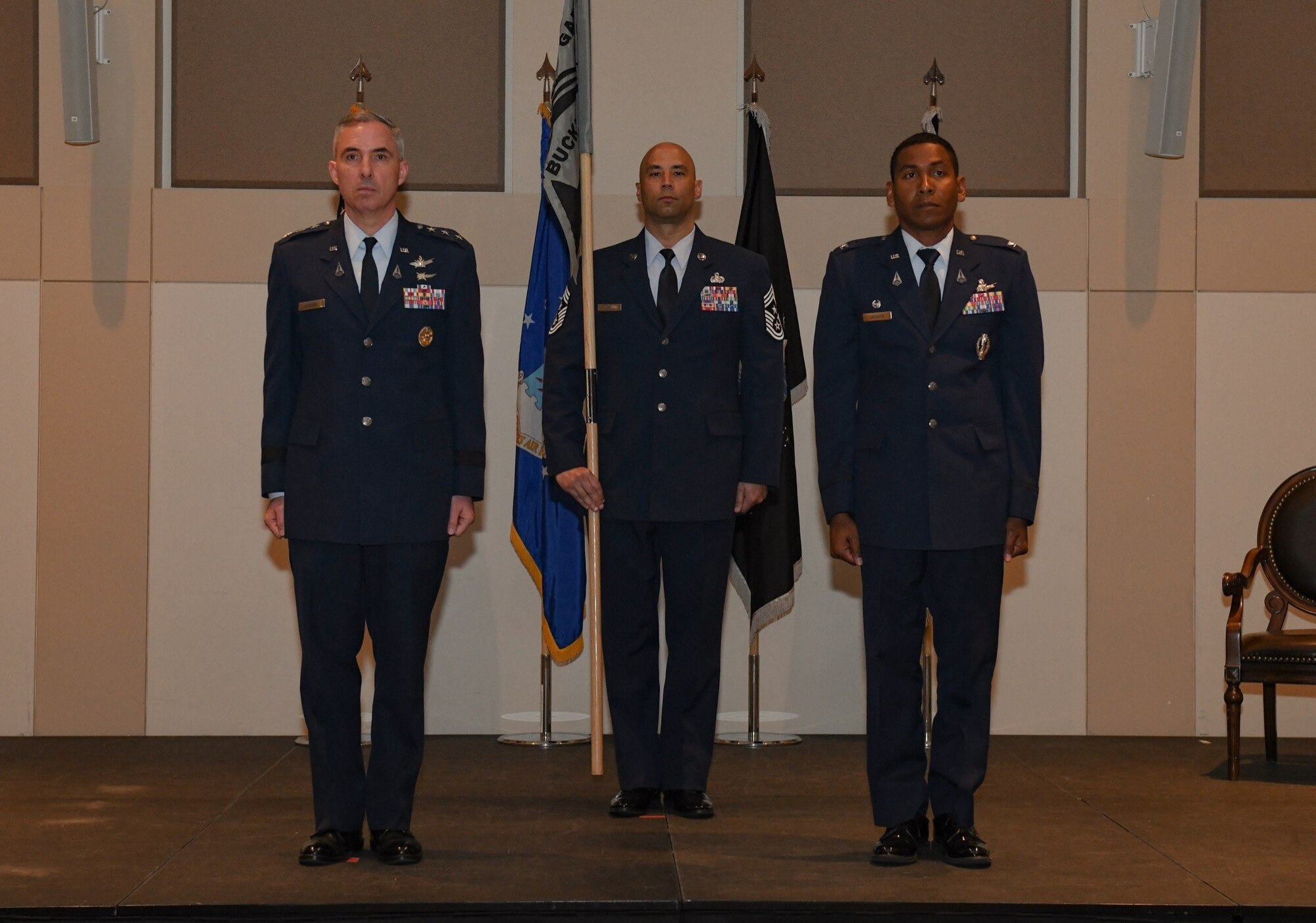 Lt. Gen. Stephen Whiting, left, Space Operations Command commander, prepares to pass the guidon to Col. Marcus Jackson, incoming Buckley Garrison commander, during the Buckley Garrison Assumption of Command Ceremony at Buckley Space Force Base, Colo., June 4, 2021. Buckley Garrison’s mission is to deliver unrivaled combat support to their joint mission partners and Allies, enabling uninterrupted missile warning, intelligence, and cyber operations.  (U.S. Space Force photo by Senior Airman Danielle McBride)