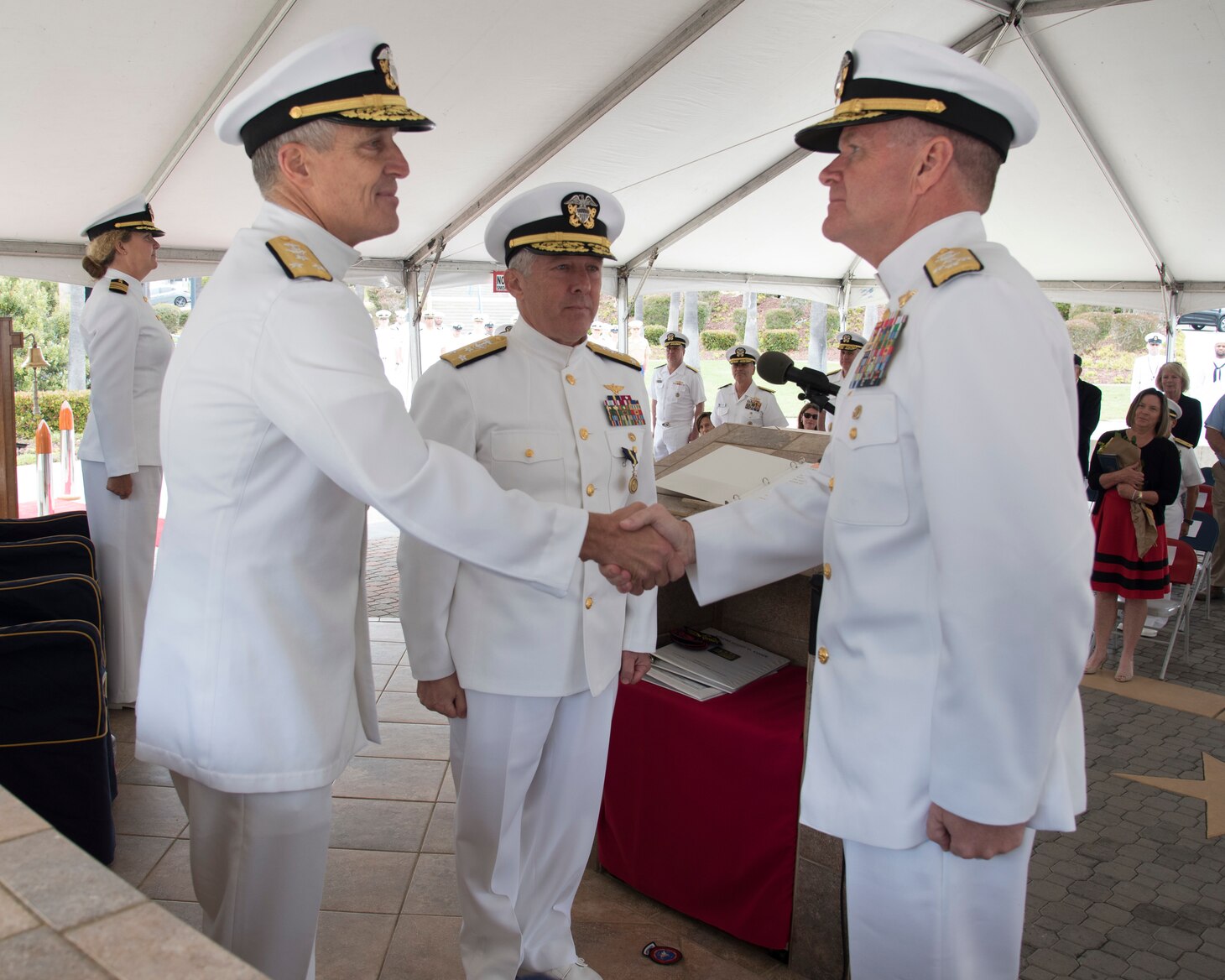 Adm. Samuel J. Paparo, commander, U.S. Pacific Fleet, congratulates Vice Adm. Stephen T. Koehler upon assuming command of U.S. 3rd Fleet during a change of command ceremony on Naval Base Point Loma, June 3.