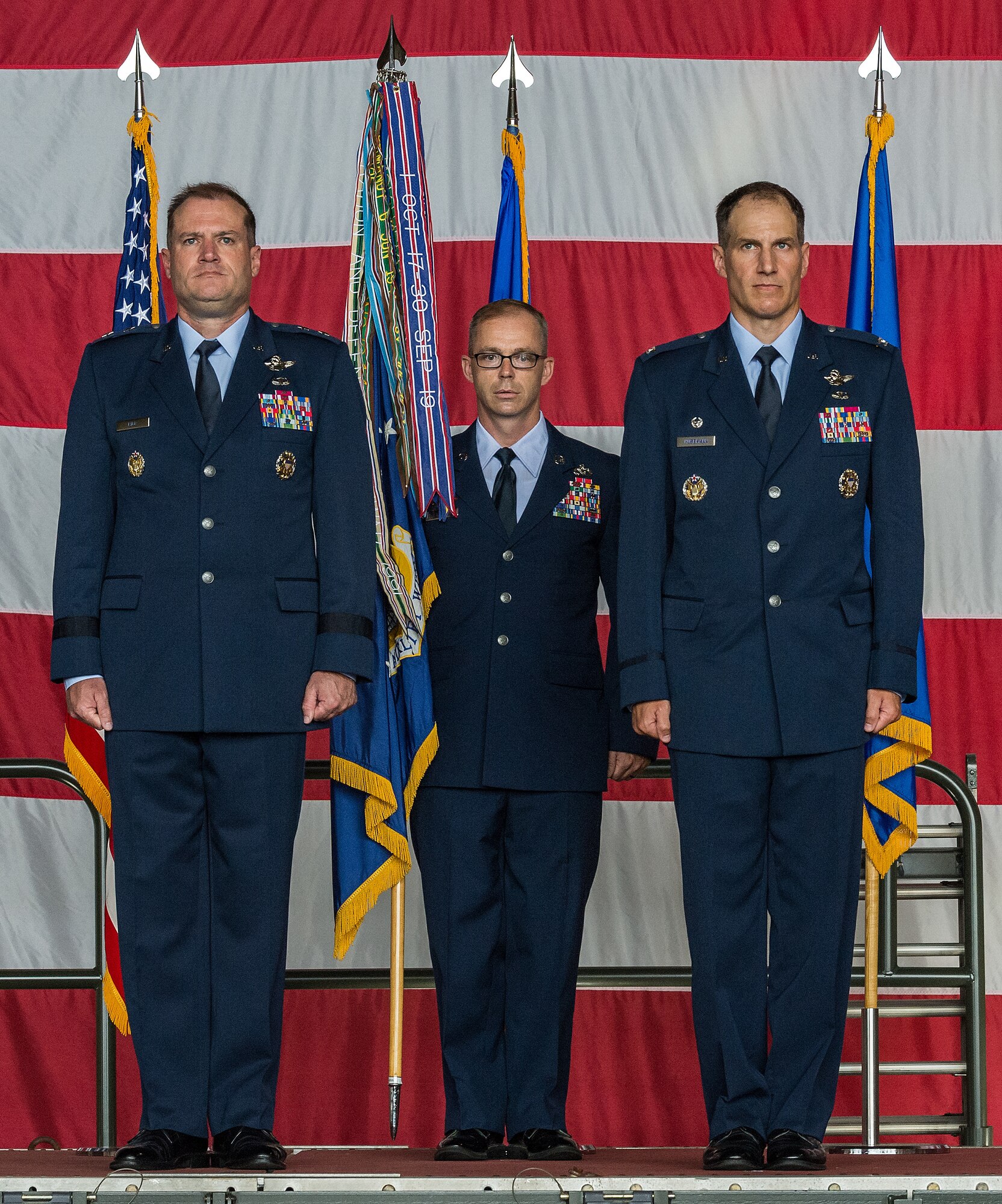 Maj. Gen. Thad Bibb, left, 18th Air Force commander; Chief Master Sgt. Timothy Bayes, 436th Airlift Wing command chief, and Col. Matthew Husemann, incoming 436th AW commander, stand at attention during the 436th AW Assumption of Command ceremony on Dover Air Force Base, Delaware, June 4, 2021. Husemann assumed command in a ceremony attended by friends, family, Team Dover members, local civic leaders and distinguished visitors. (U.S. Air Force photo by Roland Balik)