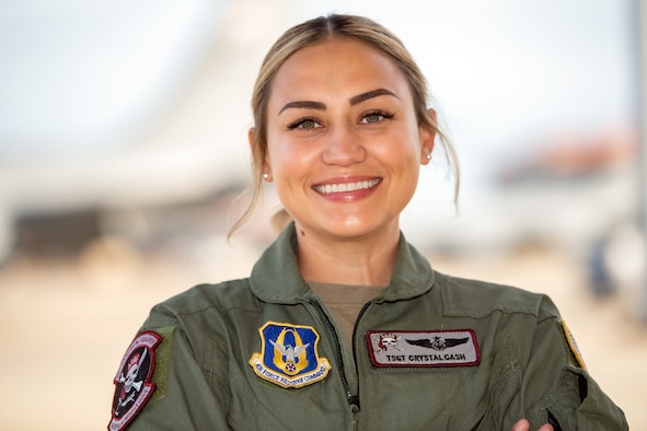 Tech Sgt. Crystal Cash, 63rd Air Refueling Squadron boom operator, pauses for a photo on the flight line, June 3, 2021, MacDill Air Force Base, Florida. Cash served at the 6th Air Refueling Wing for 6 years before transitioning to the Reserve 927th Air Refueling Wing at the same base. (U.S. Air Force photo by Staff Sgt. Bradley Tipton)
