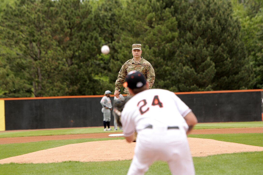 Maj. Scott Hager, Headquarters and Headquarters Company commander for the 85th U.S. Army Reserve Support Command, throws out the ceremonial first pitch during the Schaumburg Boomers Memorial Day home game vs. the Gateway Grizzlies, May 31, 2021, in Schaumburg, Illinois.