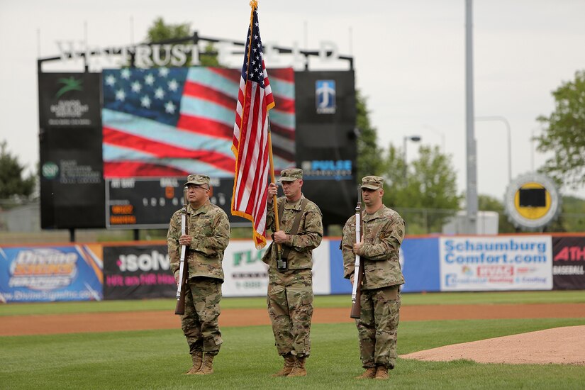 The 85th U.S. Army Reserve Support Command color guard team presents the Nation’s Colors during the Schaumburg Boomers’ Memorial Day home game, May 31, 2021, against the Gateway Grizzlies.