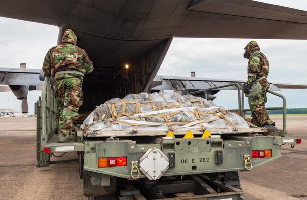 ‘Port Dawgs’ from the 189th Aerial Port Flight, Air National Guard, and from the 96th Aerial Port Squadron, Air Force Reserve, carefully load cargo onto a C-130H Hercules aircraft on June 5, 2021 at Little Rock Air Force Base, Arkansas. The total force team created training focused on a realistic deployment centered, aerial port operations. (U.S. Air Force photo by Tech. Sgt. James Phillips)