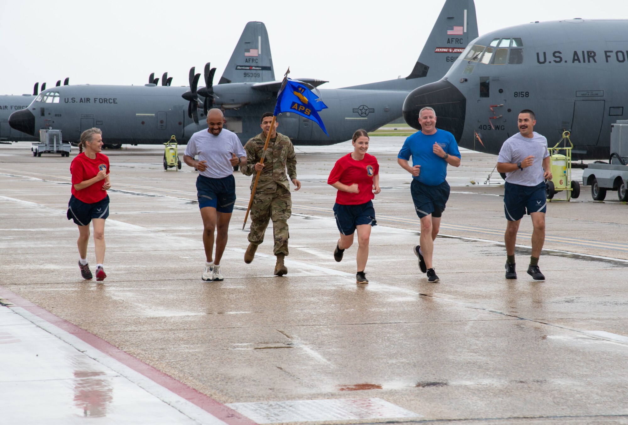 Members of the 41st Aerial Port Squadron at Keesler Air Force Base, Miss., participate in the “Port Dawg Memorial Run” on the Keesler flight line June 5, 2021. The event serves as a way for members to pay tribute to lives lost in the career-field across the entire Air Force. (U.S. Air Force photo by Staff Sgt. Kristen Pittman)