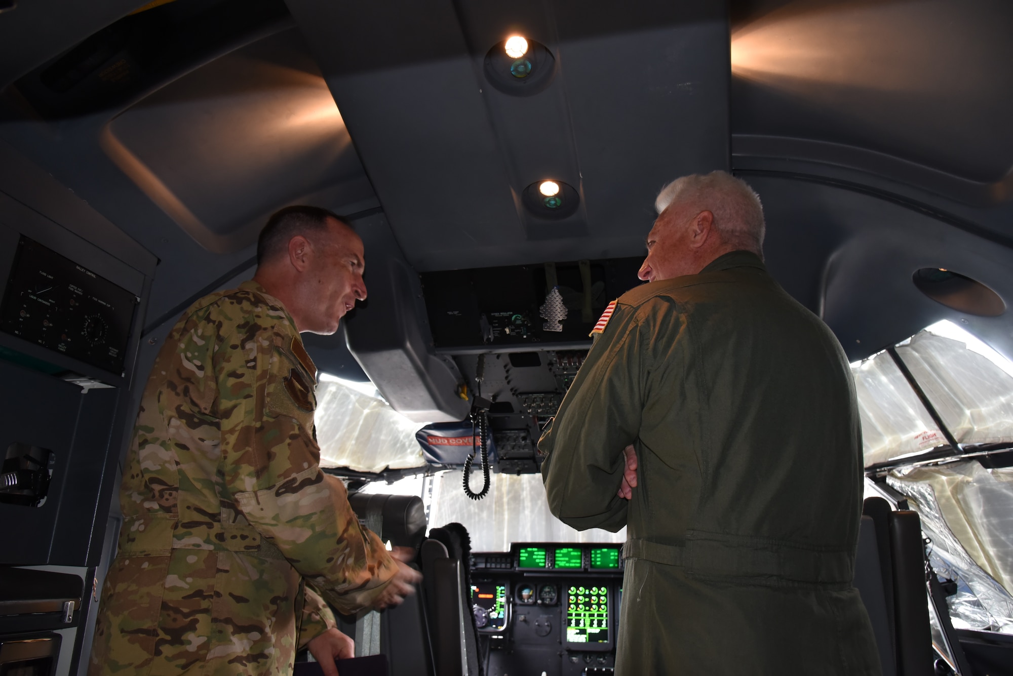 Maj. Gen. John Healy, 22nd Air Force commander, is briefed by Lt. Col. Shane Devlin, 403rd Operations Group interim commander, on the flight deck on the WC-130J Super Hercules during his visit to the 403rd Wing, June 4-5, 2021. The visit coincided with the 403rd Wing's change of command, in which Healy presided over the ceremony where Col. Stuart M. Rubio took command from Col. Jeffrey A. Van Dootingh, June 5. (U.S. Air Force photo by Jessica L. Kendziorek)