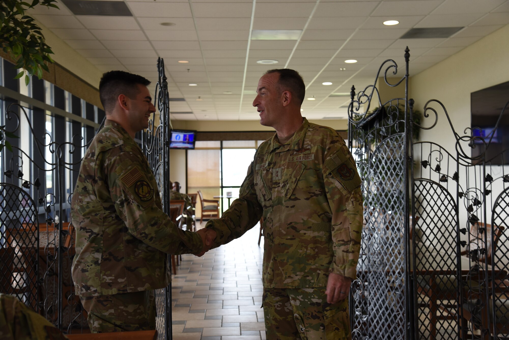 Maj. Gen. John Healy, 22nd Air Force commander, coined Senior Airman Jason Green, 403rd Maintenance Squadron aero ground equipment journeyman, during lunch while Healy and Chief Master Sgt. Imelda Johnson, 22nd AF command chief master sergeant, while they were visiting the 403rd Wing June 4-5, 2021. The visit coincided with the 403rd Wing's change of command, in which Healy presided over the ceremony where Col. Stuart M. Rubio took command from Col. Jeffrey A. Van Dootingh, June 5. (U.S. Air Force photo by Jessica L. Kendziorek)