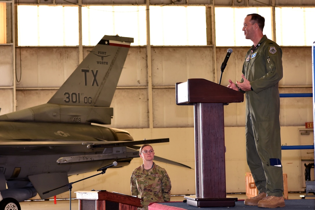 Col. Benjamin Harrison, 301st Operations Group commander, addresses his Airmen during the 301 FW OG change of command ceremony, June 6, 2021, at U.S. Naval Air Station Joint Reserve Base Fort Worth, Texas. Harrison is responsible for ensuring the safety, effectiveness, and combat readiness of all his Airmen. (U.S. Air Force photo by Staff Sgt. Randall Moose)