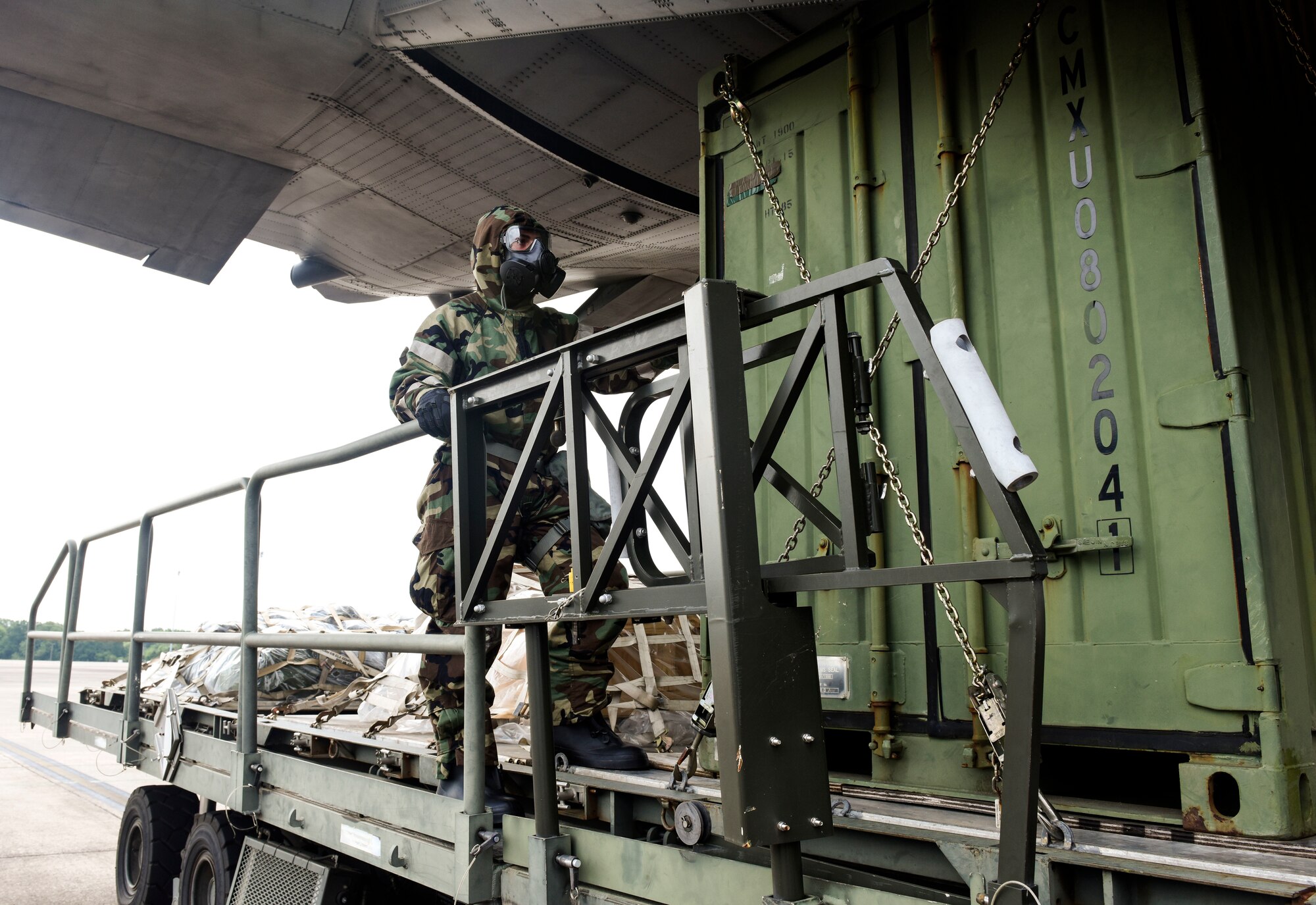 ‘Port Dawgs’ from the 189th Aerial Port Flight, Air National Guard, and from the 96th Aerial Port Squadron, Air Force Reserve, guides the cargo from the K-loader onto the ramp of a C-130H Hercules aircraft on June 5, 2021 at Little Rock Air Force Base, Arkansas. The total force team created training focused on a realistic deployment centered, aerial port operations. (U.S. Air Force photo by Tech. Sgt. James Phillips)