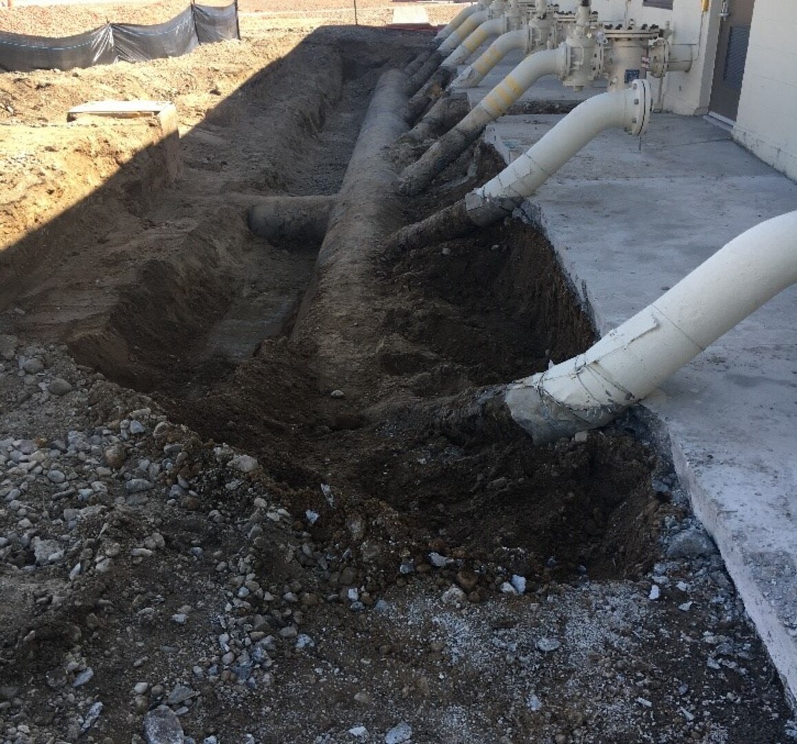 pipes exposed in dirt