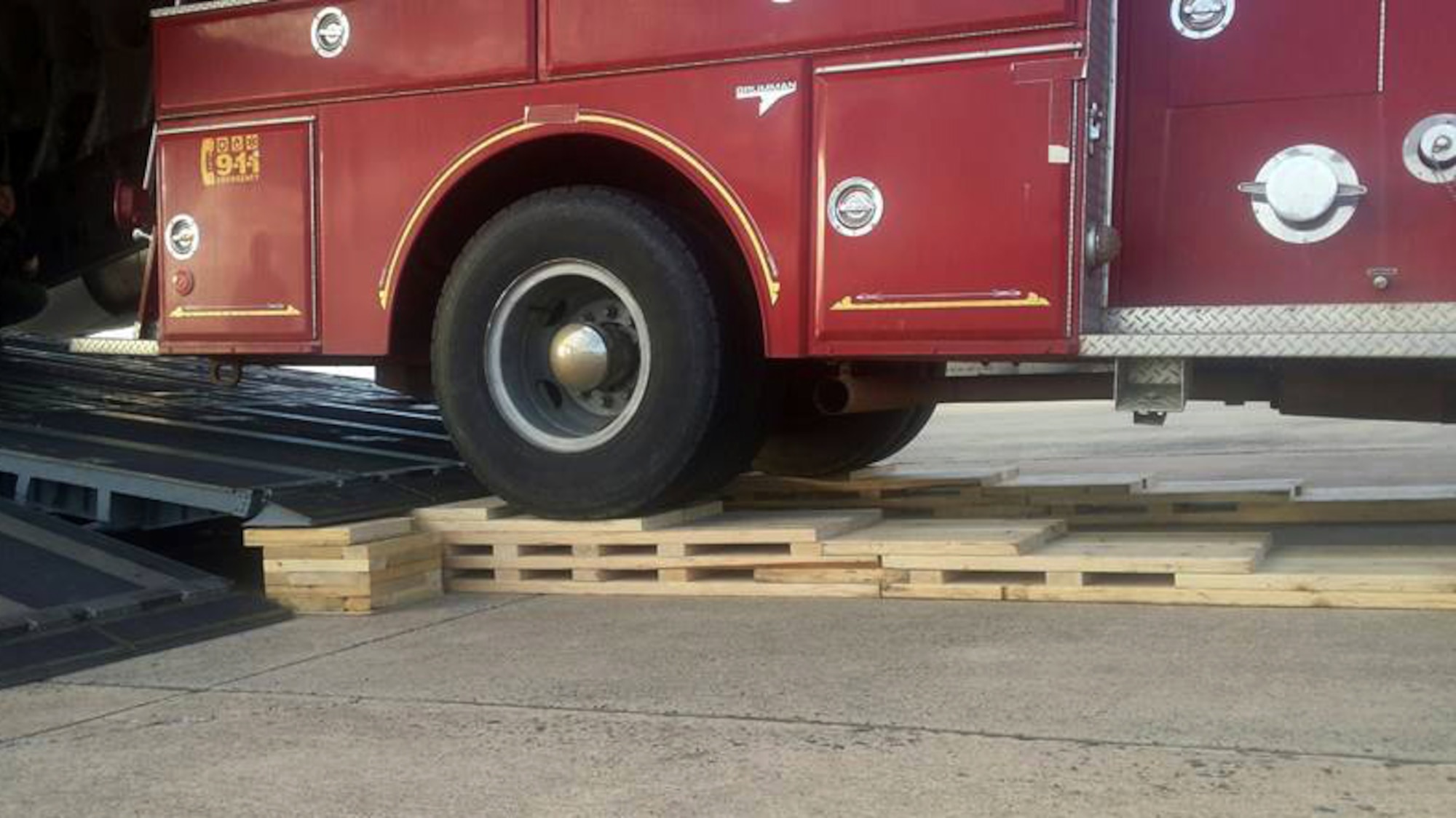 U.S. Air Force Airmen with the North Carolina Air National Guard (NCANG) construct an air transportation function ramp team to place rolling shoring at the end of a C-17 Globemaster III aircraft ramp prior to uploading a donated fire truck at the North Carolina Air National Guard Base, Charlotte Douglas International Airport, January 13, 2017. The NCANG works closely with the Denton Humanitarian Assistance Program to move donated relief items like furniture, vehicles, clothing, and food to countries following natural disasters. The fire truck will be flown from the NCANG to Charleston S.C. for a brief stop before it reaches its final destination in Guatemala.