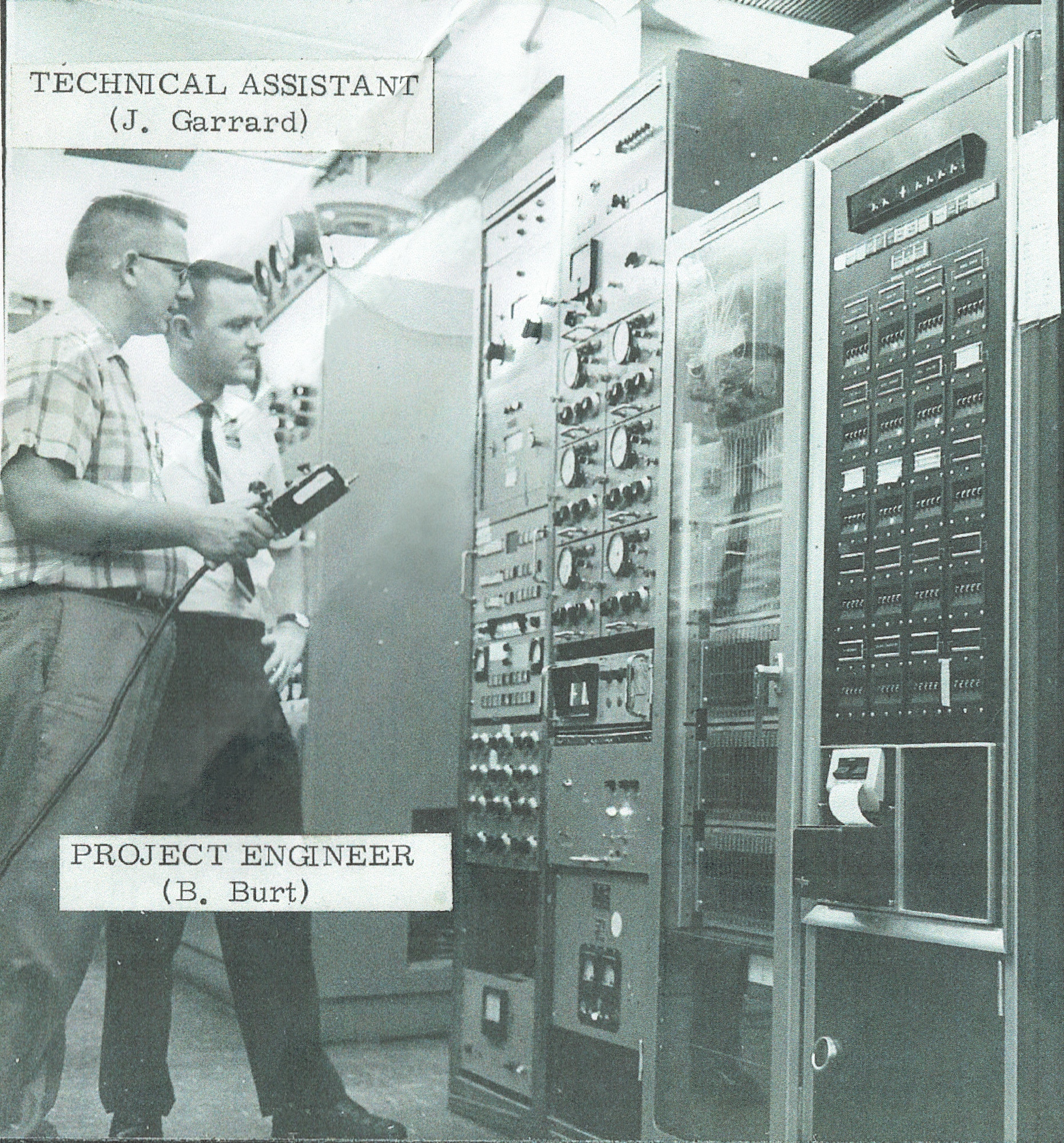 Jim Garrard, left, a technical assistant, and a Bob Burt, a project engineer, look at the force measurement instrumentation system in the Tunnel B control room in the late-1960s. (Courtesy photo)