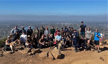 SAN DIEGO (May 27, 2021) Officers, chief petty officers, and civilians from Information Warfare Training Command (IWTC) San Diego pose for a group photo after embarking on a teambuilding hike up Cowles Mountain in San Diego. IWTC San Diego, as part of the Center for Information Warfare Training, provides a continuum of training to Navy and joint service personnel that prepares them to conduct information warfare across the full spectrum of military operations. (U.S. Navy photo)