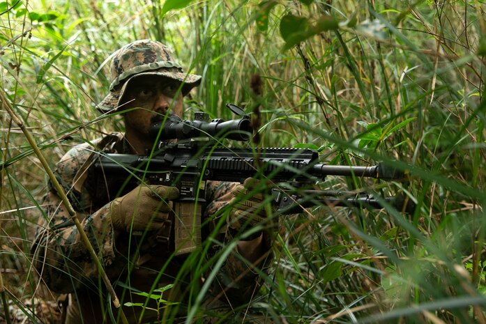 U.S. Marine Corps Lance Cpl. Kyle Cook, a rifleman with 3rd Battalion, 3rd Marines, prepares for an ambush during Jungle Warfare Exercise in the Northern Training Area on Okinawa, Japan, May 25, 2021. This unscripted force-on-force exercise tested and strengthened the Marines’ ability to operate within distributed jungle and littoral environments, while adapting to a thinking peer-level adversary. 3/3 is forward-deployed in the Indo-Pacific under 4th Marines, 3rd Marine Division, as a part of the Unit Deployment Program. Cook is a native of Arlington, Texas.
