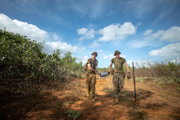 Australian Army Engineer Tyson Buckley and U.S. Marine Corps Lance Cpl. Deitrick McMahon, a combat engineer with Combat Logistics Battalion 7, Marine Rotational Force – Darwin, build a barbed wire fence during exercise Crocodile Response at Point Fawcett, NT, Australia, May 25, 2021. Exercise Crocodile Response tested the ability of MRF-D and the Australian Defence Force to provide disaster relief in the Indo-Pacific region. The rotational deployment of U.S. Marines affords a combined training opportunity with Australia and improves cooperation and integration between the two country’s forces.