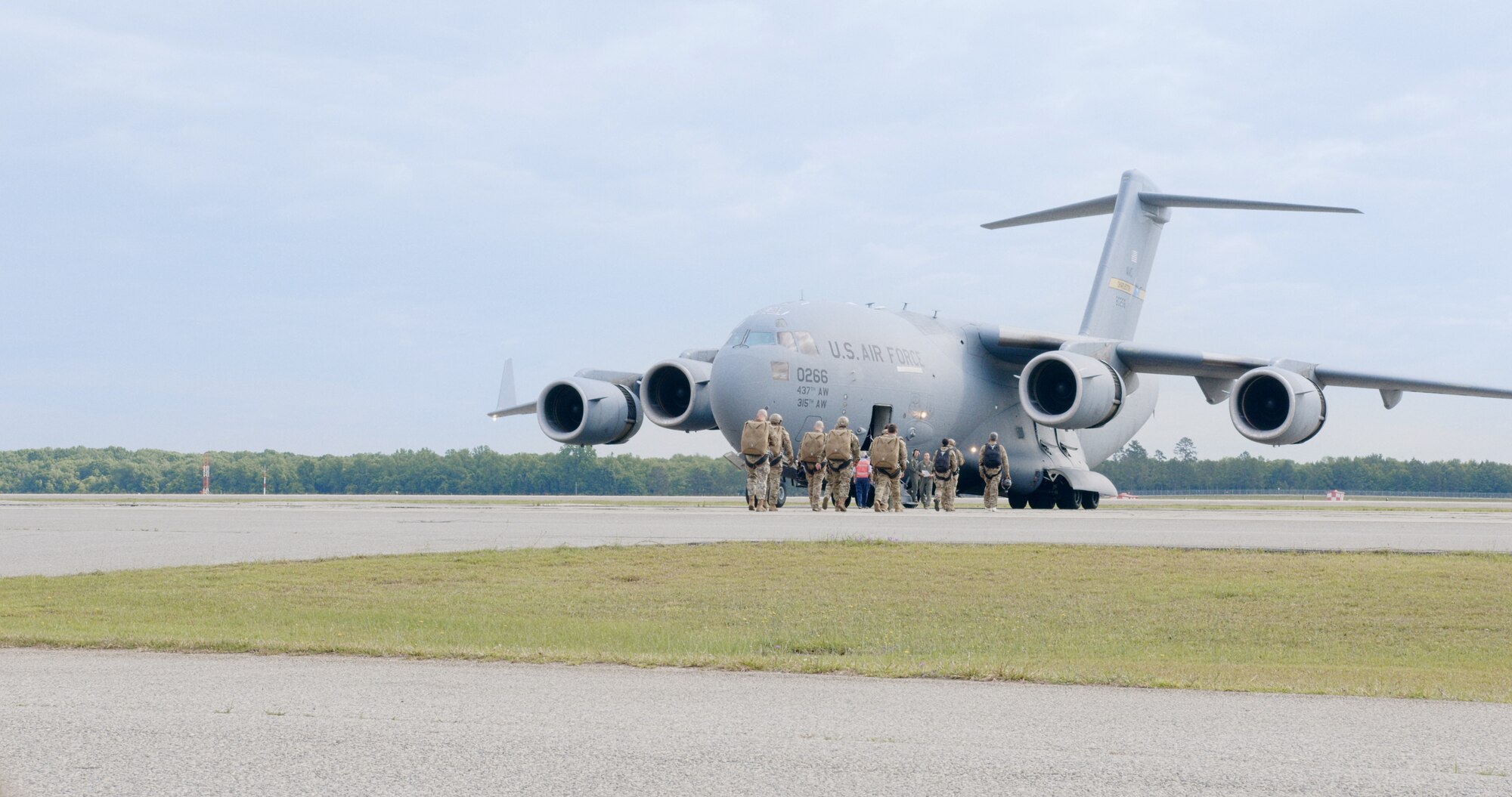 Survival, evasion, resistance and escape specialists, pararescue jumpers and Army jumpmasters board a C-17 for a joint readiness exercise at Robins Air Force Base, Georgia, May 11. (U.S. Air Force photo by Jacob Keenum)