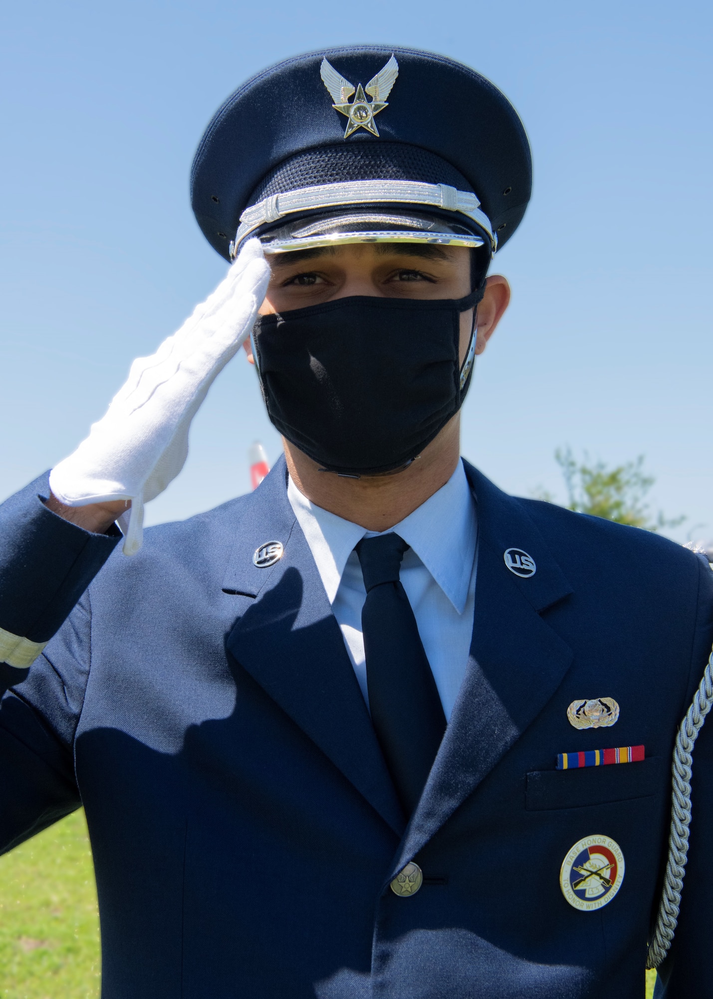 Honor guard member renders a salute at Tyndall Air Force Base, Florida, April 19, 2021.