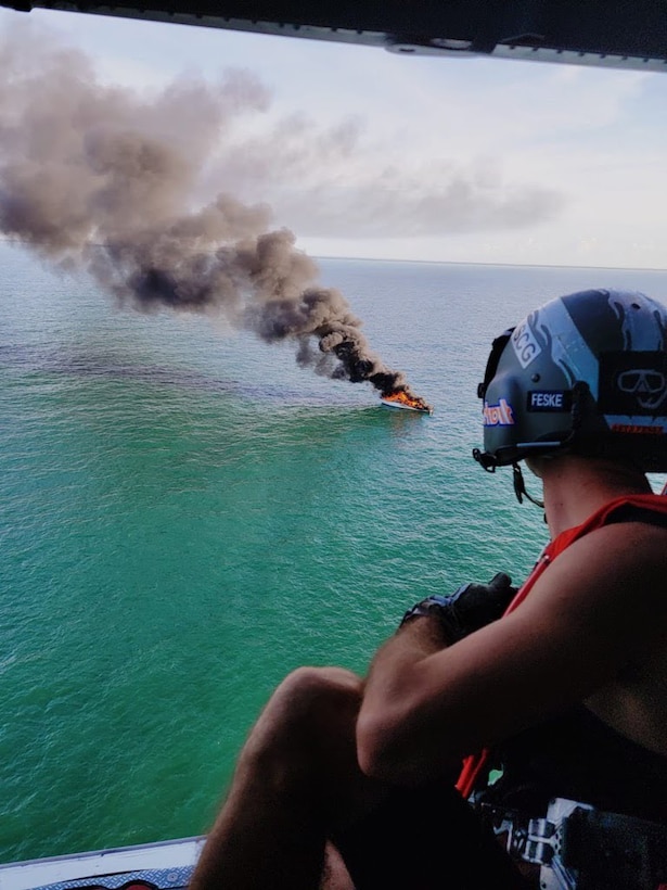 A good Samaritan and the Coast Guard rescued five people from a life raft after their 57-foot boat caught fire 5 miles offshore Capers Inlet, South Carolina, June 02, 2021. The 57-foot boat had 1,200 gallons of diesel on board. (U.S. Coast Guard photo)
