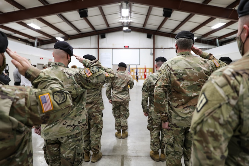 Soldiers from the 238th Regiment Salute the American Flag