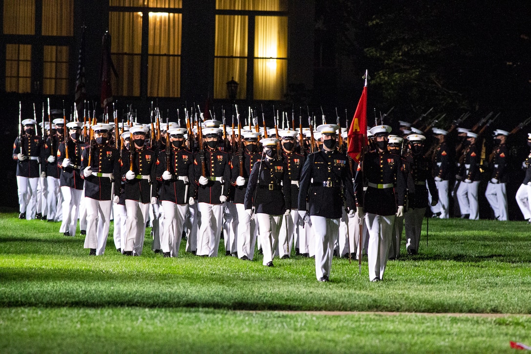 Marines with Alpha Company march for “Pass in Review” during the Friday Evening Parade at Marine Barracks Washington, June 4, 2021. The guest of honor for the evening was The Honorable Michèle A. Flournoy, 9th Undersecretary of Defense for Policy, and the hosting official for the evening was Lt. Gen. Charles G. Chiarotti, Deputy Commandant for Installations and Logistics. (U.S. Marine Corps photo by Lance Cpl. Mark A. Morales)