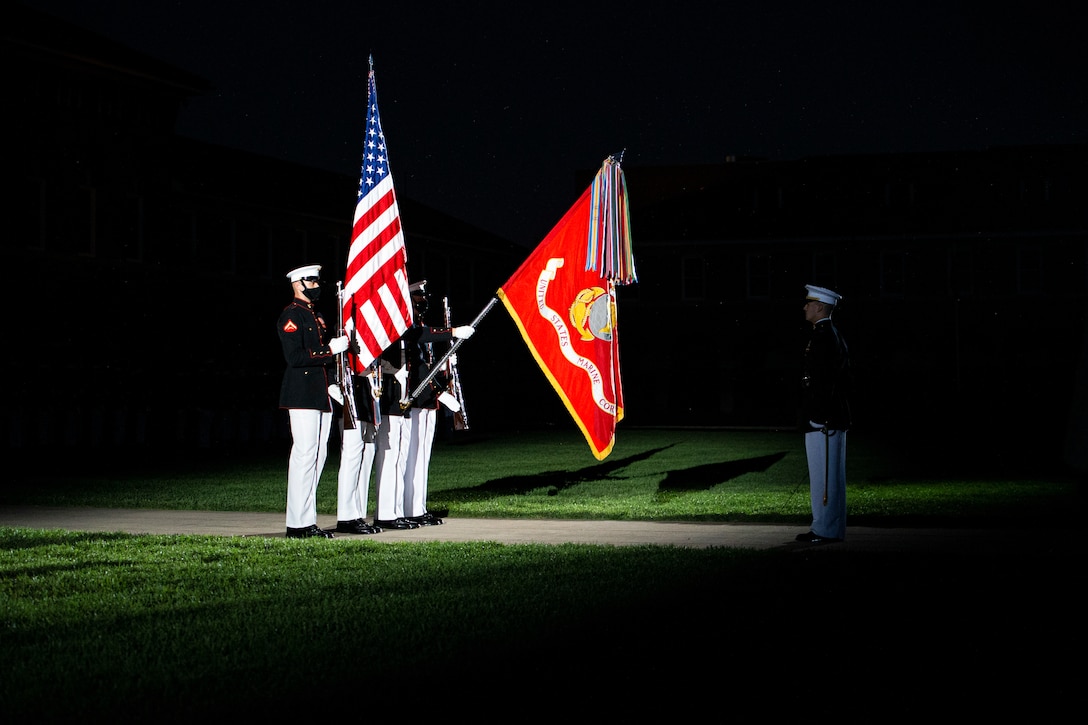 Marines with the Official U.S. Marine Corps Color Guard present the colors during the Friday Evening Parade at Marine Barracks Washington, June 4, 2021. The guest of honor for the evening was The Honorable Michèle A. Flournoy, 9th Undersecretary of Defense for Policy, and the hosting official for the evening was Lt. Gen. Charles G. Chiarotti, Deputy Commandant for Installations and Logistics. (U.S. Marine Corps photo by Lance Cpl. Tanner D. Lambert)