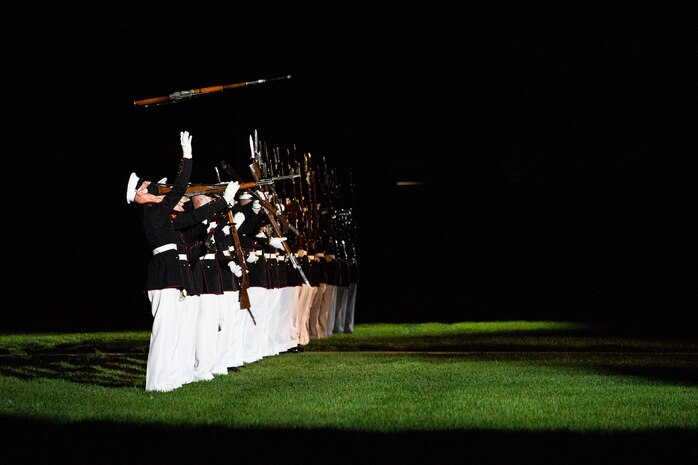 Marines with the Silent Drill Platoon perform their “long line” sequence during the Friday Evening Parade at Marine Barracks Washington, June 4, 2021.