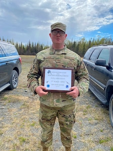 Alaska Air National Guard Staff Sgt. Matthew Larson, a security forces member with the 268th Security Forces Squadron, poses for a photo after the annual Adjutant General Match, May 16, 2021. Larson took first place in the open rifle marksmanship competition, was added to the state team to compete in the regional competition, and was awarded the Governor's Twenty tab, which is generally awarded to the top 20 marksmen in the state. (Courtesy photo)