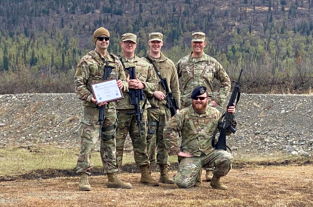 Alaska Air National Guard Staff Sgt. Matthew Larson, a security forces member with the 268th Security Forces Squadron, and his team pose for a photo after the annual Adjutant General Match, May 16, 2021. Larson took first place in the open rifle marksmanship competition, was added to the state team to compete in the regional competition, and was awarded the Governor's Twenty tab, which is generally awarded to the top 20 marksmen in the state. (Courtesy photo)