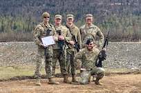 Alaska Air National Guard Staff Sgt. Matthew Larson, a security forces member with the 268th Security Forces Squadron, and his team pose for a photo after the annual Adjutant General Match, May 16, 2021. Larson took first place in the open rifle marksmanship competition, was added to the state team to compete in the regional competition, and was awarded the Governor's Twenty tab, which is generally awarded to the top 20 marksmen in the state. (Courtesy photo)