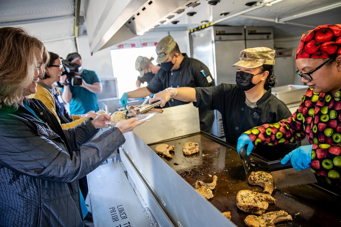 Representatives from local businesses participate in the Alaska Army National Guard’s Culinary Showcase, an event celebrating the launch of the new Partnership for Youth Success (PaYS) program on Joint Base Elmendorf-Richardson, May 14. The PaYS program is a strategic partnership between the Army National Guard and a cross section of private businesses, universities, and public institutions. It provides Alaska’s newest Citizen-Soldiers the opportunity to increase their prospects for potential civilian employment while serving their country. (U.S. Army National Guard photo by Edward Eagerton)