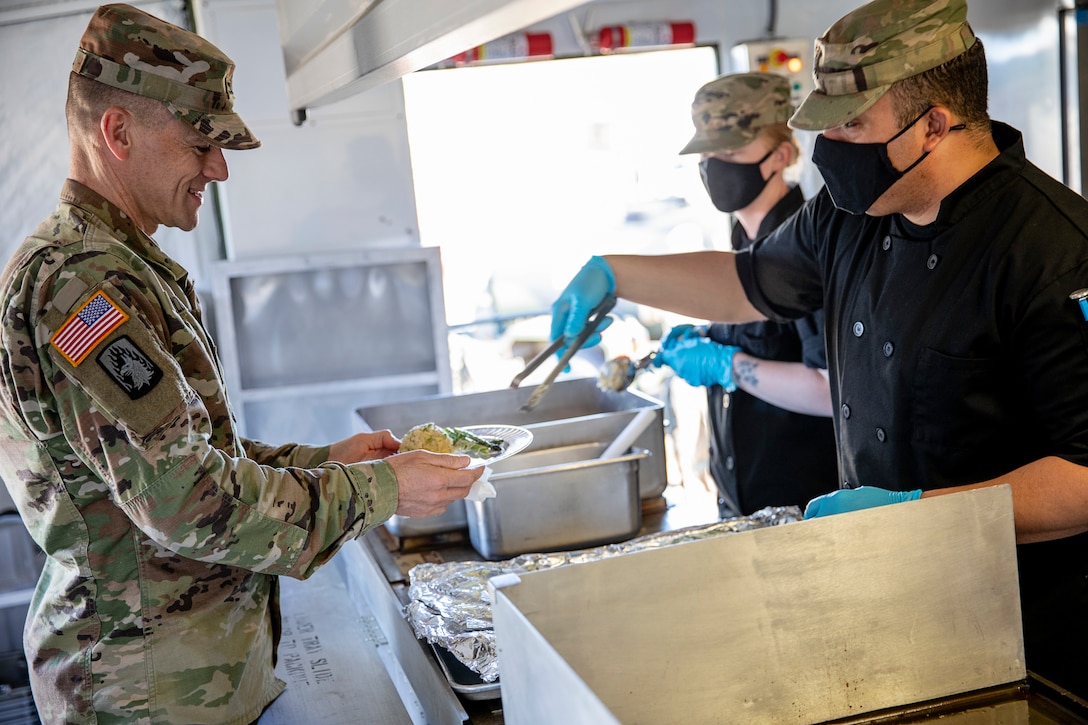 Representatives from local businesses participate in the Alaska Army National Guard’s Culinary Showcase, an event celebrating the launch of the new Partnership for Youth Success (PaYS) program on Joint Base Elmendorf-Richardson, May 14. The PaYS program is a strategic partnership between the Army National Guard and a cross section of private businesses, universities, and public institutions. It provides Alaska’s newest Citizen-Soldiers the opportunity to increase their prospects for potential civilian employment while serving their country. (U.S. Army National Guard photo by Edward Eagerton)