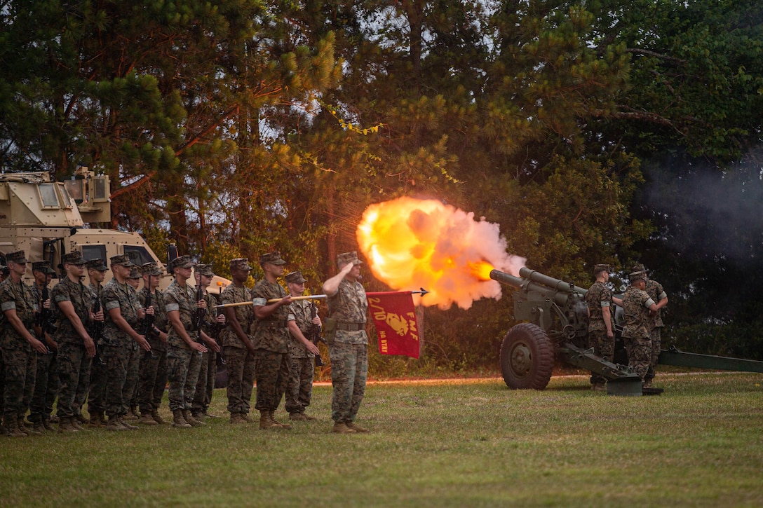 U.S. Marines with 10th Marine Regiment, 2d Marine Division, perform a 21-gun salute during a change of command ceremony on Camp Lejeune, N.C., June 3, 2021. The ceremony represents the transfer of authority, responsibility, and accountability from the out-going officer to the incoming commanding officer. (U.S. Marine Corps photo by Lance Cpl. Brian Bolin Jr.)