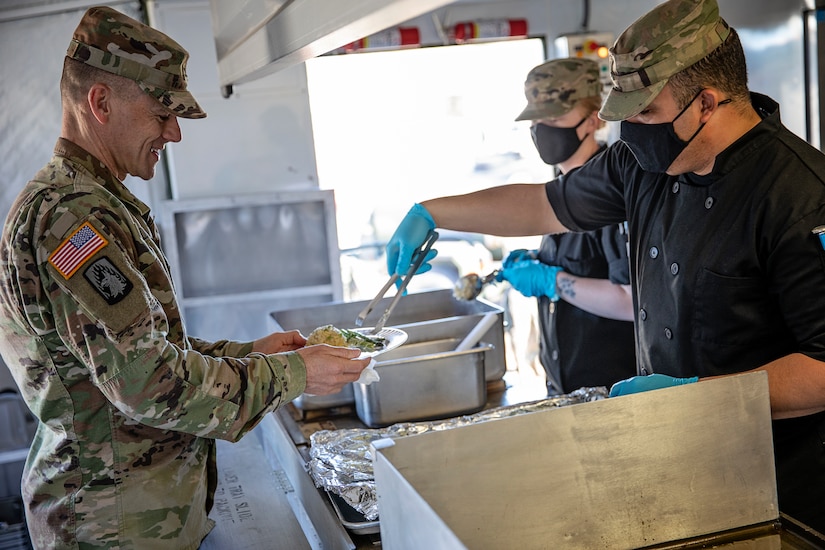 Representatives from local businesses participate in the Alaska Army National Guard’s Culinary Showcase, an event celebrating the launch of the new Partnership for Youth Success (PaYS) program on Joint Base Elmendorf-Richardson, May 14. The PaYS program is a strategic partnership between the Army National Guard and a cross section of private businesses, universities, and public institutions. It provides Alaska’s newest Citizen-Soldiers the opportunity to increase their prospects for potential civilian employment while serving their country. (U.S. Army National Guard photo by Edward Eagerton)