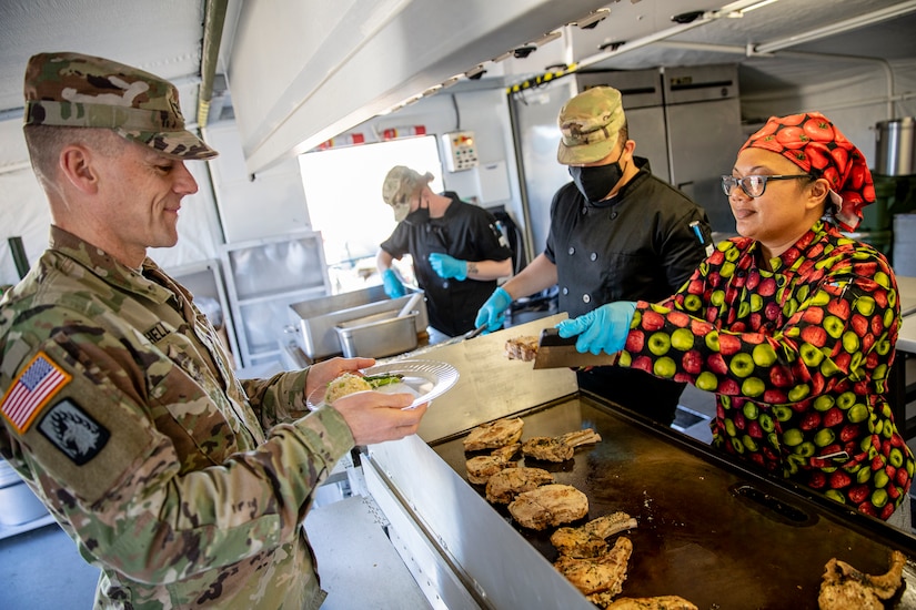 Representatives from local businesses participate in the Alaska Army National Guard’s Culinary Showcase, an event celebrating the launch of the new Partnership for Youth Success (PaYS) program on Joint Base Elmendorf-Richardson, May 14. The PaYS program is a strategic partnership between the Army National Guard and a cross section of private businesses, universities, and public institutions. It provides Alaska’s newest Citizen-Soldiers the opportunity to increase their prospects for potential civilian employment while serving their country. (U.S. Army National Guard photo by Edward Eagerton)