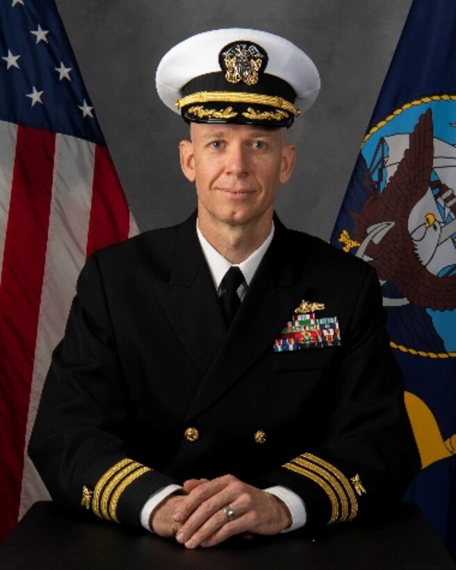 A headshot of a Navy commander